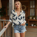 Women's long-sleeved blouse with classic raven pattern